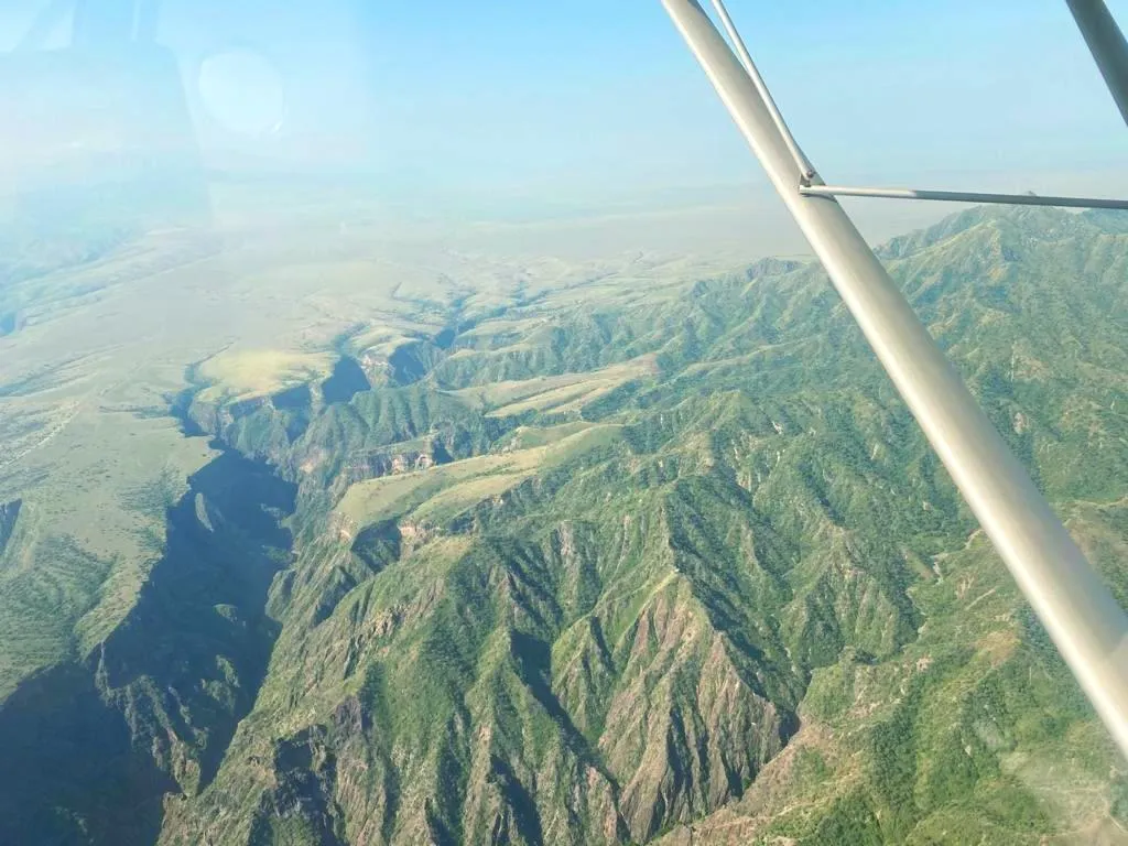 Green canyon and mountain ridges of Tanzania seen from a ZRP aircraft