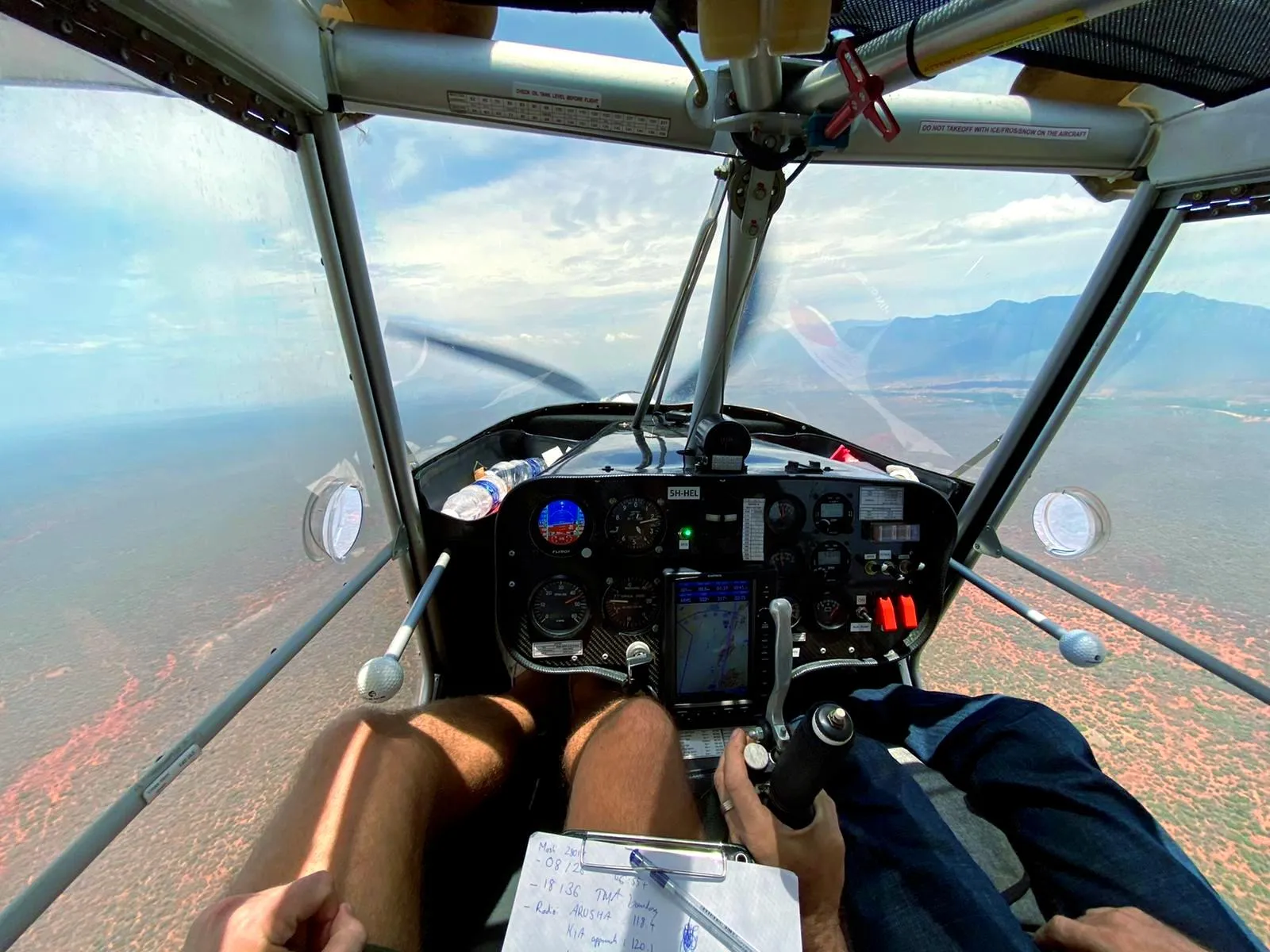In-flight cockpit view of a ZRP light sport aircraft flying over northern Tanzania