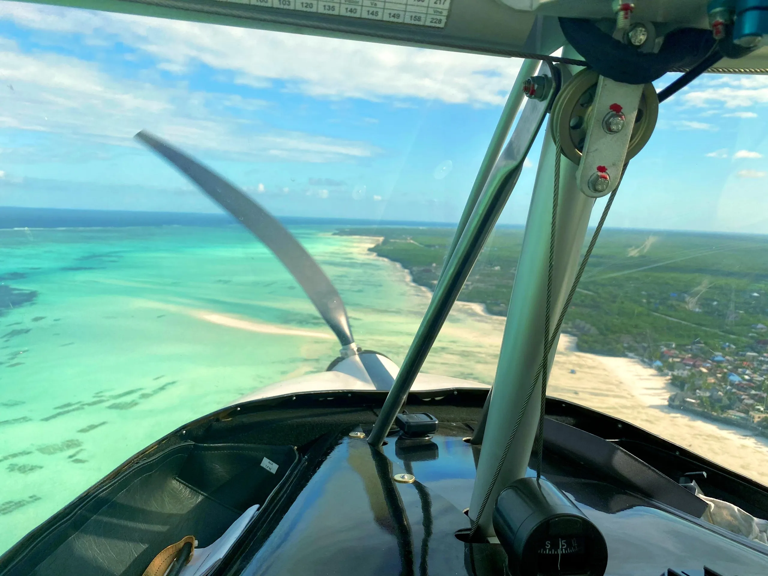 Turquoise lagoons and sandbanks of Zanzibar from above