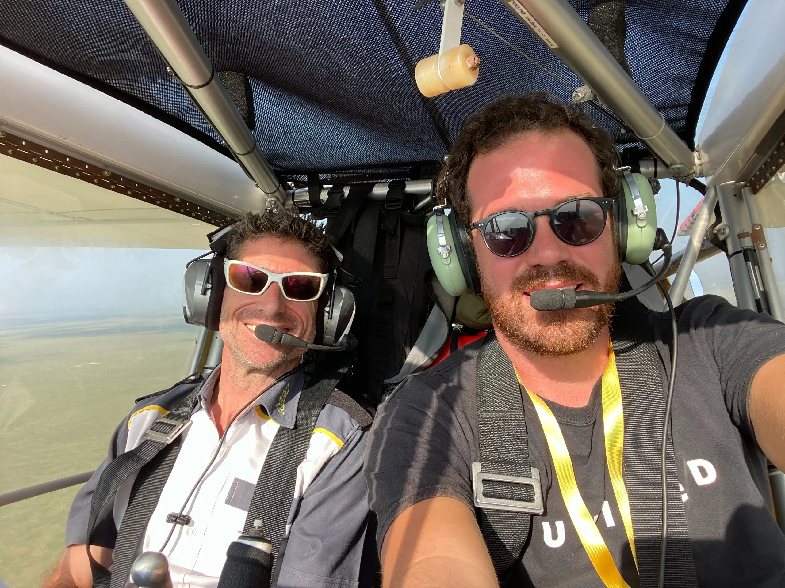 ZRP instructor and student smiling in the cockpit during a training flight